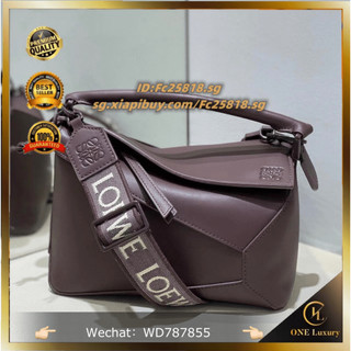 7.5 Best quality single color glaze Puzzleee geometric bag made of satin cowhide material, handbag. Sling bag size: 24 * 10.5 * 16.5cm